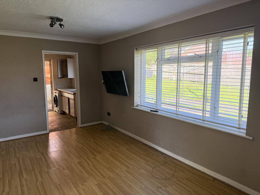 Lot: 112 - VACANT THREE-BEDROOM BUNGALOW ON PLOT OF 0.3 ACRES - Second living room with utility room in background